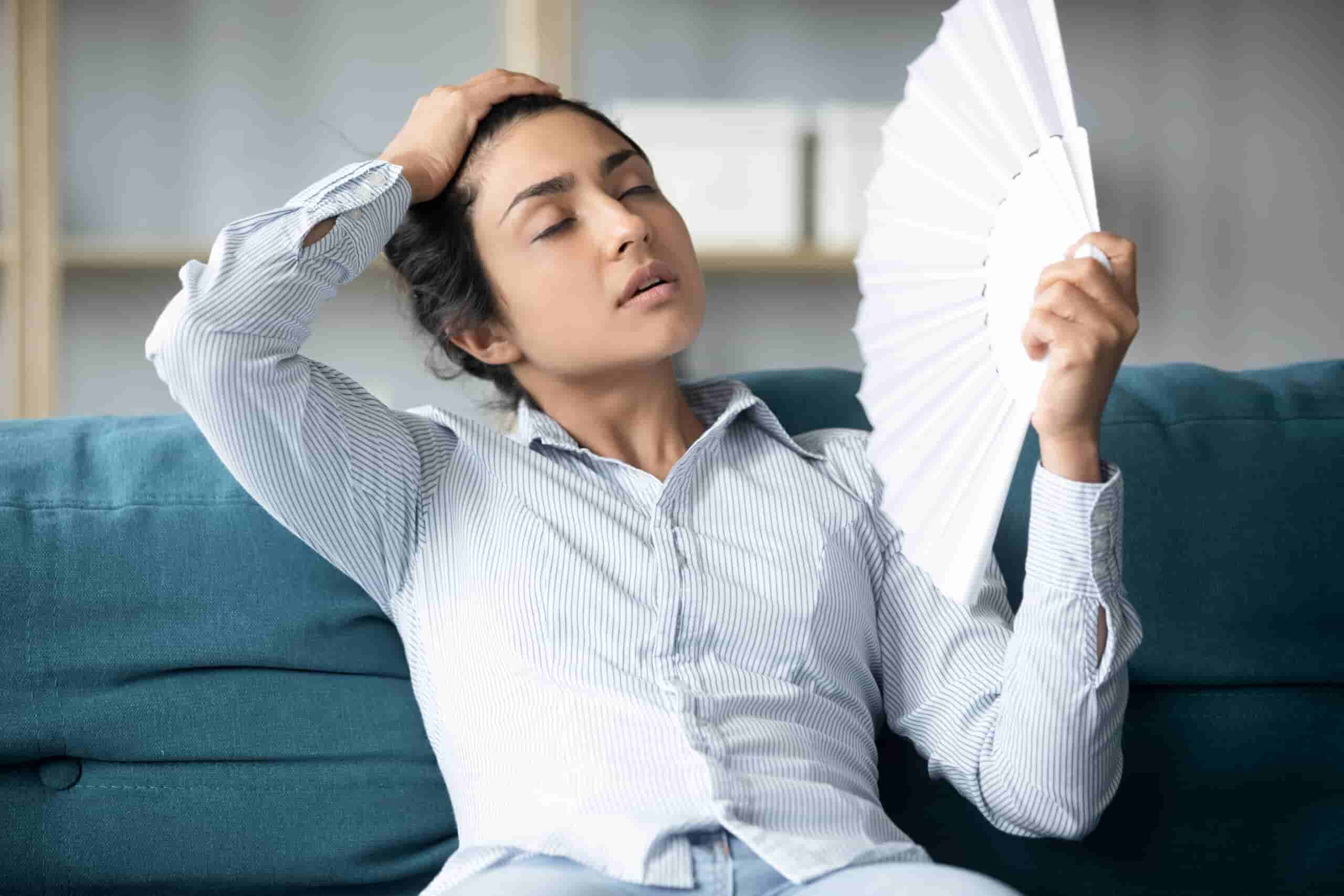 Woman needing AC repair because AC isn't cooling